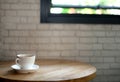 White coffee mug on a wooden table And white brick background Royalty Free Stock Photo