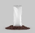White coffee pouch mockup, packaging presentation on coffee beans, front view, isolated on background Royalty Free Stock Photo
