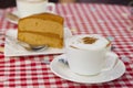 White coffee on Red and white Gingham Plaid cloth Table Royalty Free Stock Photo
