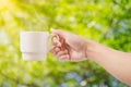Coffee cup in hand in morning Royalty Free Stock Photo