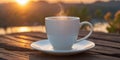 White coffee or tea mug at outdoor table during beautiful sunrise. Royalty Free Stock Photo