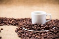 White coffeecup on coffeebeans