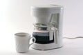White coffeemaker, cup, isolated