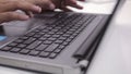 White collar worker hand is typing the computer or laptop at workplace