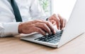 White collar worker typing laptop computer keyboard at office desk Royalty Free Stock Photo