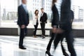 White collar workers going down office corridor during working day. Royalty Free Stock Photo
