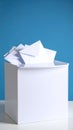 White collection box filled with many paper envelopes suggesting mail voting or surveys Royalty Free Stock Photo
