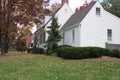 White colonial home in autumn