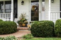 White colonial home decorated for fall Royalty Free Stock Photo