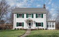 White Colonial House with Green Shutters