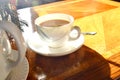 A cup of hot tea with milk on mug, put on wooden table and bright light  from sun in afternonn, Traditional english tea. Royalty Free Stock Photo