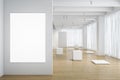 White color empty art gallery with airy interior design: big windows closed by light curtains, stages chaotically situated on Royalty Free Stock Photo