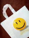 White color friendly bag with White handle on brown background