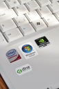 A white color laptop and Q keyboard detail, Windows Vista and brands