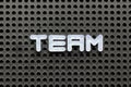 White letter in word team on black pegboard background Royalty Free Stock Photo
