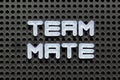 White letter in word teammate on black pegboard background Royalty Free Stock Photo