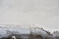 White color painted old peeling cracked plaster wall background Royalty Free Stock Photo