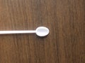 Thin long plastic spoon