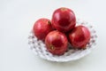 White colored plate of pomegranate friuits Royalty Free Stock Photo
