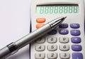 White colorful calculator with a pen on white Royalty Free Stock Photo