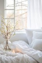 White Comforter Bed With Flower Vase