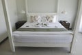 White comfy  bed in luxury hotel for rest in holidays Royalty Free Stock Photo