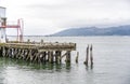 Wooden commercial pier in Astoria at the mouth of the Columbia River in the Pacific Ocean Royalty Free Stock Photo