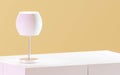 white commode with table lamp in bright minimalism interior and orange wall background 3d render illustration Royalty Free Stock Photo