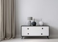 White commode with table lamp in bright minimalism interior style