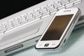 White communicator on silver laptop. Royalty Free Stock Photo