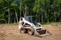 CROW WING CO, MN - 6 JUN 2021: Bobcat S185, white compact front end loader Royalty Free Stock Photo