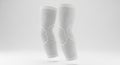 White Compression Sleeves with Textured Knit Design on a Plain Background Royalty Free Stock Photo