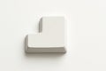 White computer enter key detached keycap top down flat lay with stepped profile on white Royalty Free Stock Photo