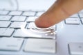 White computer keyboard and finger touch the key Royalty Free Stock Photo