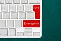Computer keyboard with word emergency and number 911 Royalty Free Stock Photo
