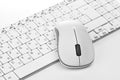 White computer mouse on the keyboard Royalty Free Stock Photo