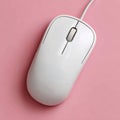 White computer mouse on pink background, minimalistic design. Royalty Free Stock Photo
