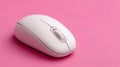 White computer mouse on a pink background. Royalty Free Stock Photo