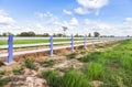 White concrete fence in green farm