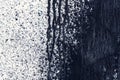 White concrete wall with black paint drips, abstract background Royalty Free Stock Photo