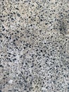 Textured photograph, concrete wall with cracks, black dots from wood, marble, background, for design.