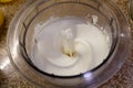 White confectionery cream in a round transparent container