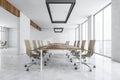 White conference room with furniture near window in business office