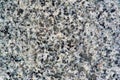 White consistent stone with gray, black and cream accents. Fortaleza White. Cinza Mundo Novo. Tile for finishing street curbs Royalty Free Stock Photo