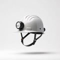 White construction helmet with headlamp turned on black strap falling, isolated on white Royalty Free Stock Photo