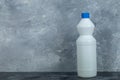 White container of bleach on marble background Royalty Free Stock Photo