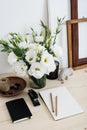 White contemporary feminine work desk with flowers