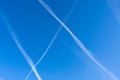 White contrails of three planes in clear blue sky. Jet trails on blue sky. Royalty Free Stock Photo