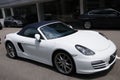 A white convertible sports car on display