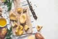 White Cooking background with wild chanterelles on a cutting board, spices and knife